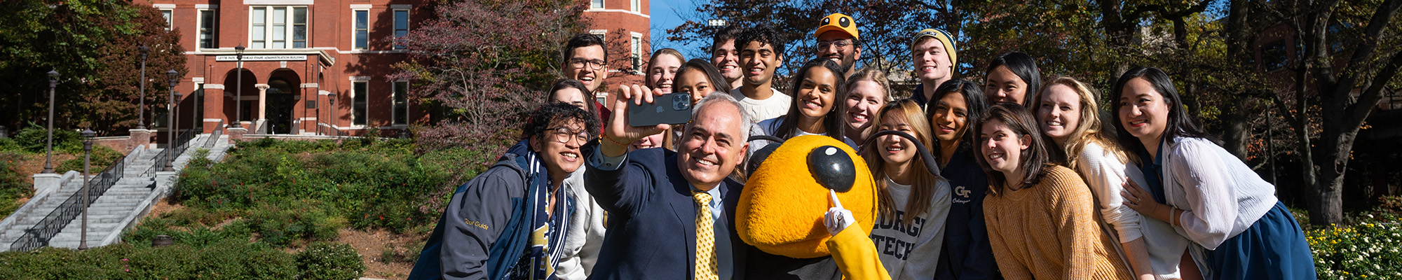 President Cabrera poses with students outside Tech Tower.